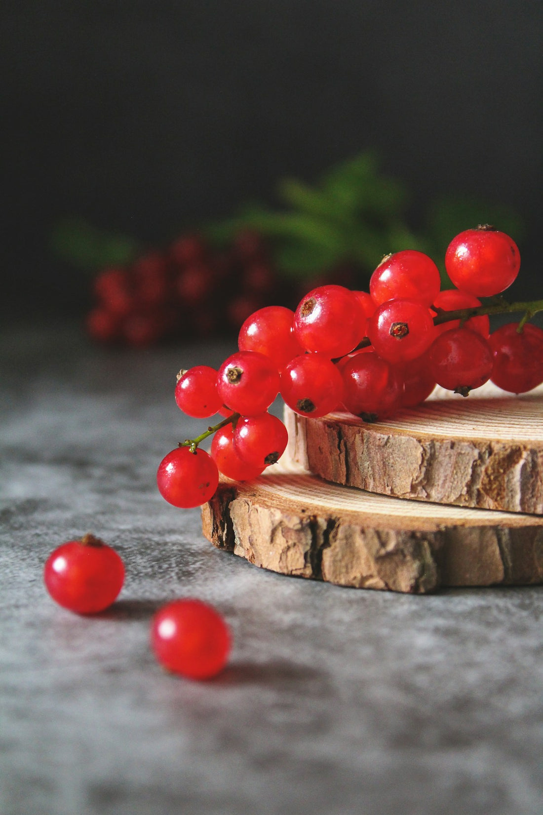 Small red Amazon superfruit berries on a wooden board